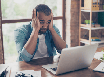 Frustrated person at computer