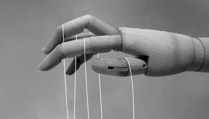 A puppet controlling puppet strings