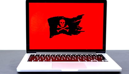 black pirate flag image with red background on a laptop screen